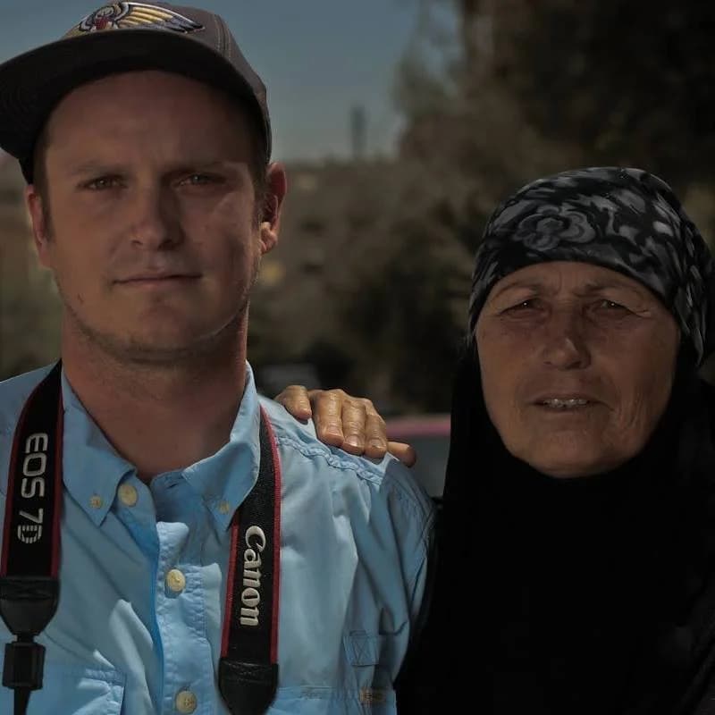 Robert with participant during Dear World project